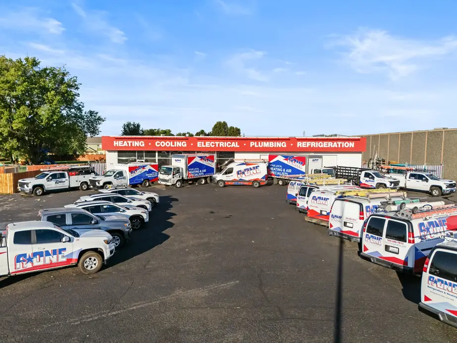 Aerial view of the A-One shop in Pasco with its vans, box trucks and pickups parked in a horseshoe