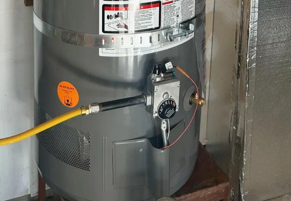 Gas control valve, sediment trap and flex gas connector on a newly installed water heater